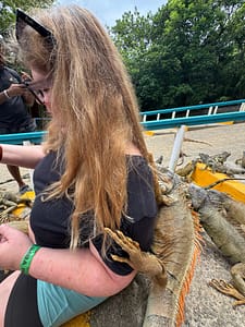 bridget with an iguana on her back at Arch's Iguana and Marine Park