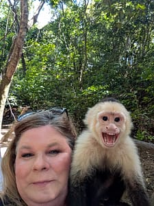bridget and white faced capuchin monkey at Gumbalimba Park
