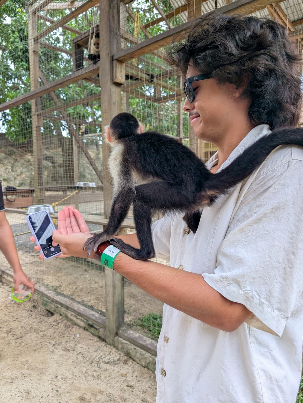 jude with monkey at AJ's sloths and monkeys in roatan